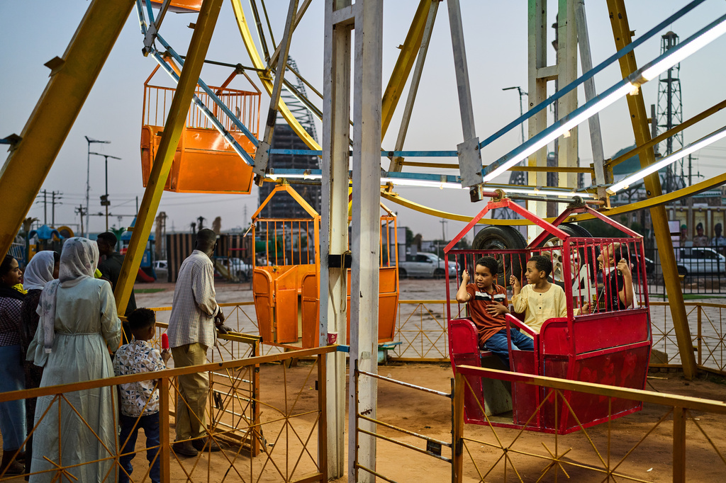 Children enjoy an amusement park in downtown Khartoum, Sudan, Sunday, April 19, 2026. (AP Photo/Bernat Armangue)
