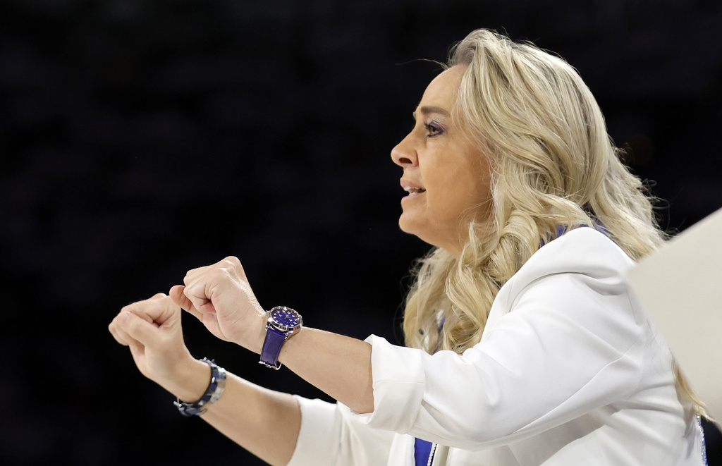 Las Vegas Aces head coach Becky Hammon calls out to players during the first half of Game 1 against the Seattle Storm in the first round of the WNBA basketball playoffs Sunday, Sept. 14, 2025, in Las Vegas. (AP Photo/Steve Marcus)