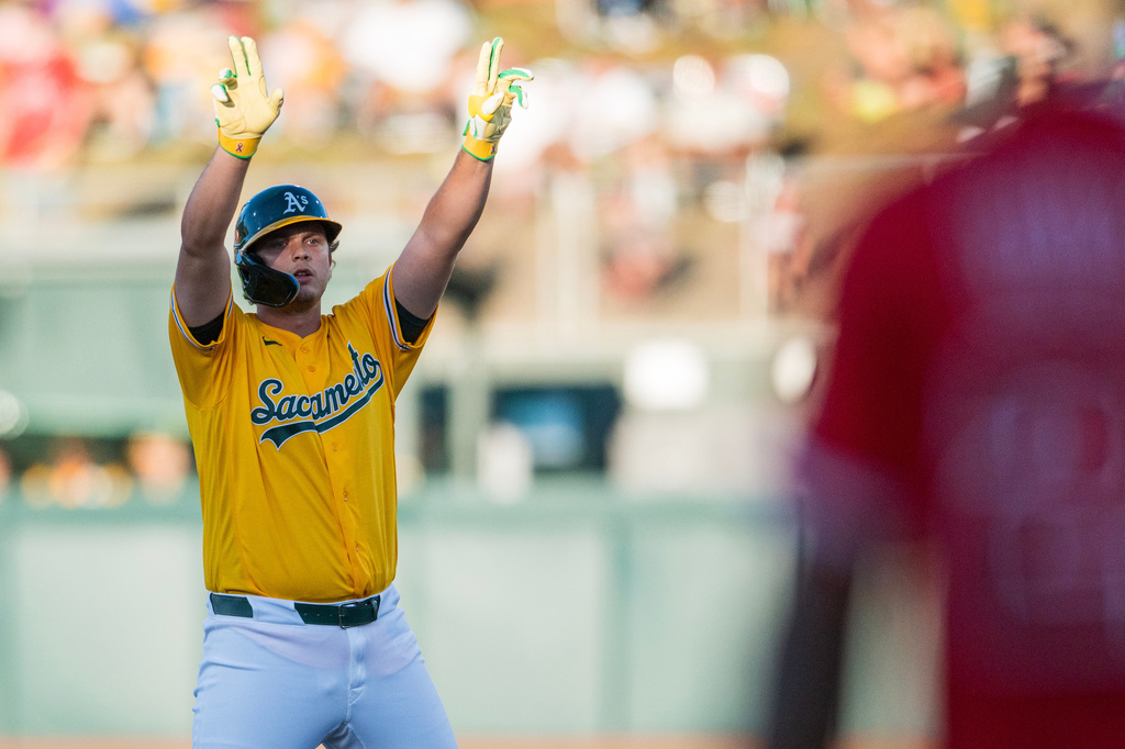 Athletics' Nick Kurtz celebrates after hitting a double during the first inning of a baseball game against the Los Angeles Angels in West Sacramento, Calif., Saturday, June 20, 2026. (AP Photo/Nic Coury)
