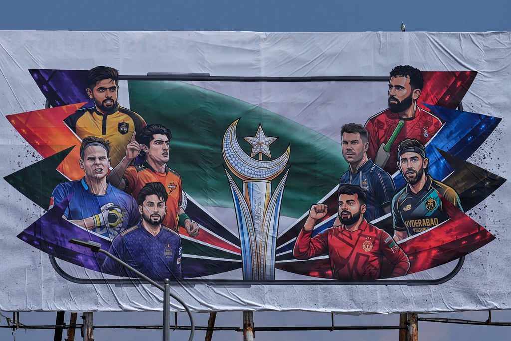 A billboard of Pakistan's premier domestic T20 the Pakistan Super League, which will take place in empty stadiums due to the recent spike in oil prices, is displayed at a road in Rawalpindi, Pakistan, Tuesday, March 24, 2026. (AP Photo/Anjum Naveed)