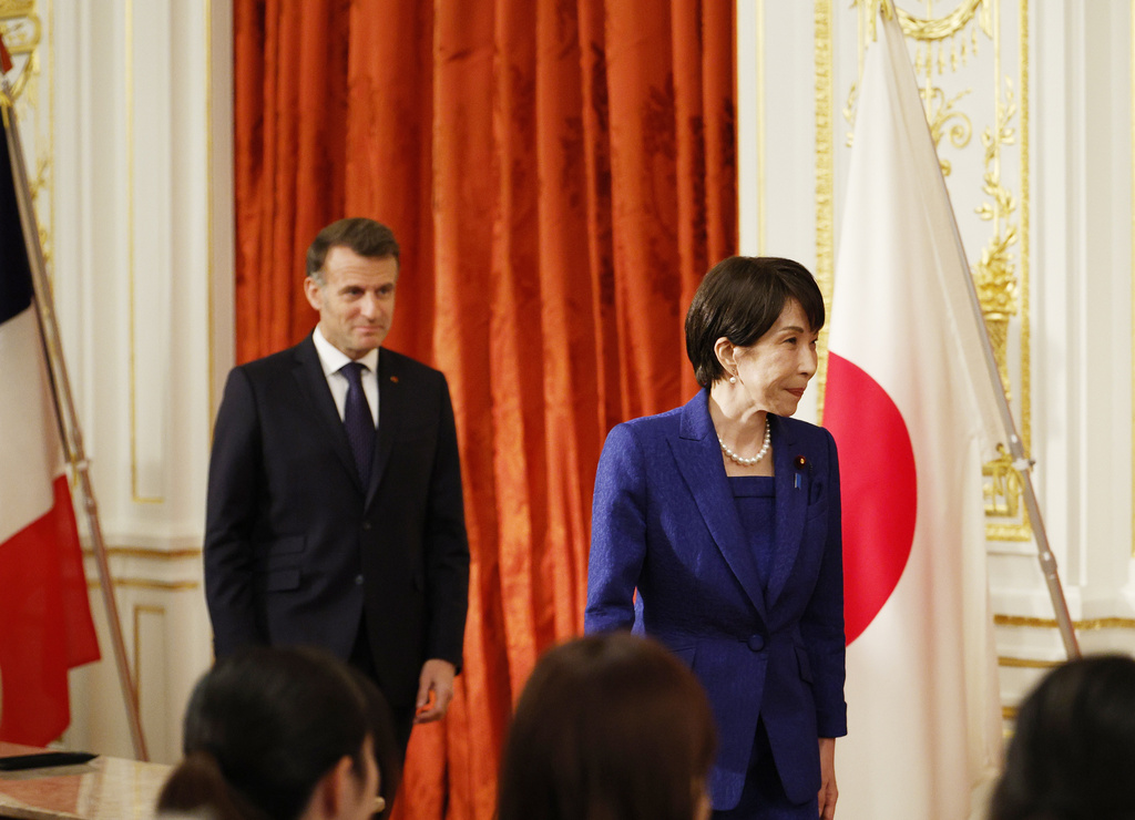 Japanese Prime Minister Sanae Takaichi, right, and French President Emmanuel Macron arrive for signing ceremony at the Akasaka Palace state guest house in Tokyo Wednesday, April 1, 2026. (Franck Robichon/Pool Photo via AP)
