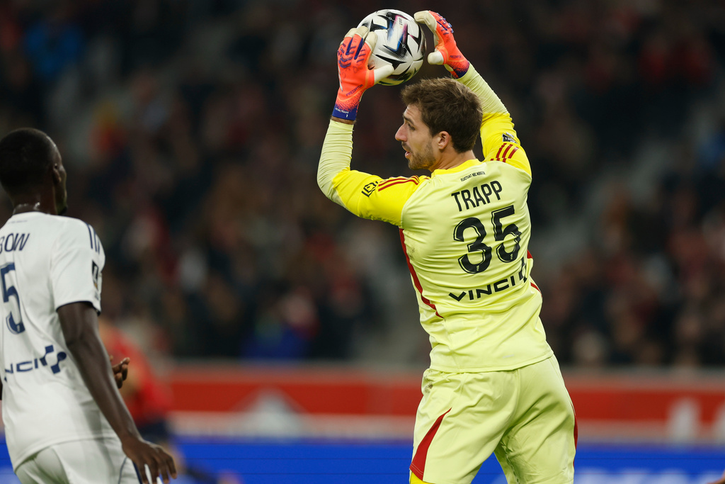 Paris FC's goalkeeper Trapp Kevin catches the ball during the French League One soccer match between Lille and Paris FC in Lille, France, Sunday Nov. 23, 2025. (AP Photo/Jean-Francois Badias)