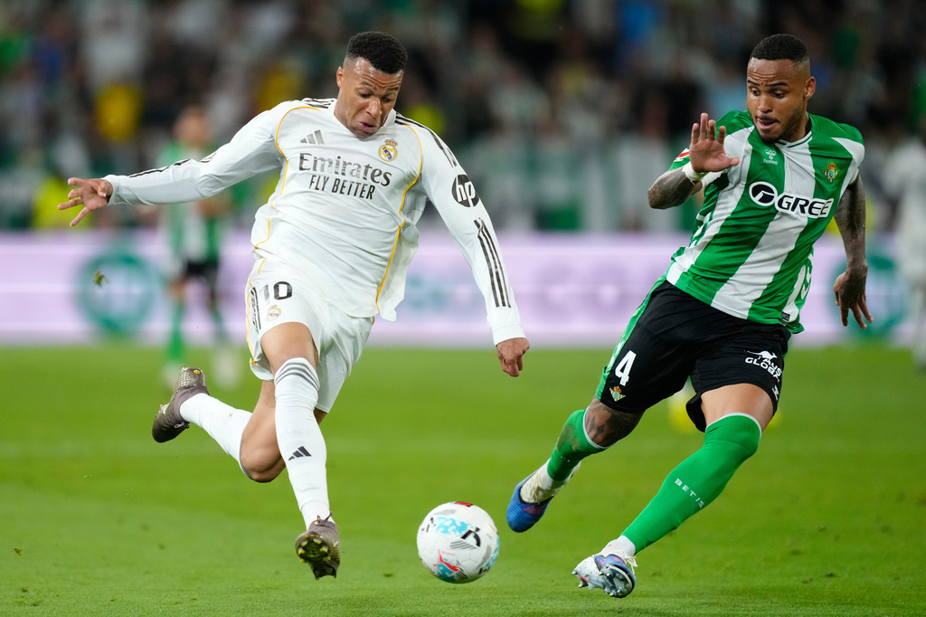 Betis' Natan guards Real Madrid's Kylian Mbappe during a La Liga soccer match between Real Betis and Real Madrid in Seville, Spain, Friday, April 24, 2026. (AP Photo/Jose Breton)