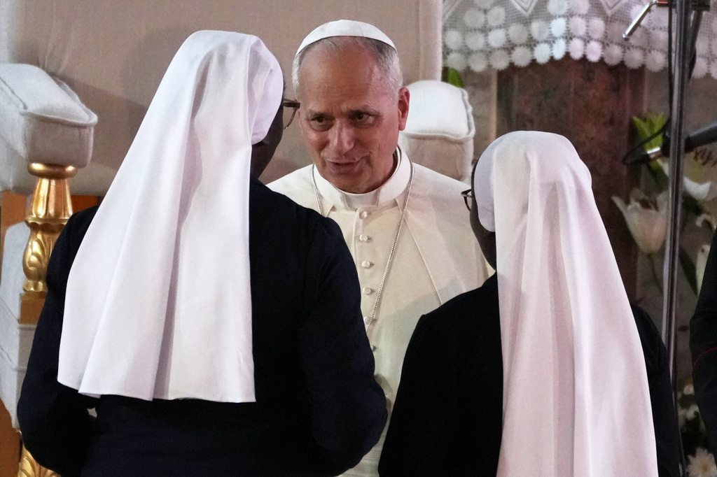Pope Leo XIV meets with two nuns who had been kidnapped by separatists in the area of Bemenda, the epicenter of the a separatist conflict, during a meeting for peace with the local community at Saint Joseph's Cathedral in Bamenda, Cameroon, Thursday, April 16, 2026, on the fourth day of his 11-day pastoral visit to Africa. (AP Photo/Andrew Medichini)