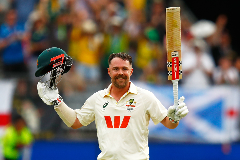 Australia's Travis Head celebrates his century on day two of the first Ashes cricket test match between Australia and England in Perth, Saturday, Nov. 22, 2025.(AP Photo/Gary Day)