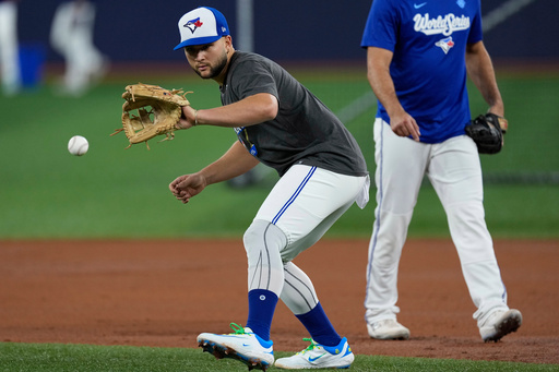 Toronto Blue Jays' Bo Bichette fields a ball during a World Series baseball media day, Thursday, Oct. 23, 2025, in Toronto. The Toronto Blue Jays face the Los Angeles Dodgers in Game 1 on Friday. (AP Photo/David J. Phillip) Toronto Blue Jays' Bo Bichette fields a ball during a World Series baseball media day, Thursday, Oct. 23, 2025, in Toronto. The Toronto Blue Jays face the Los Angeles Dodgers in Game 1 on Friday. (AP Photo/David J. Phillip)