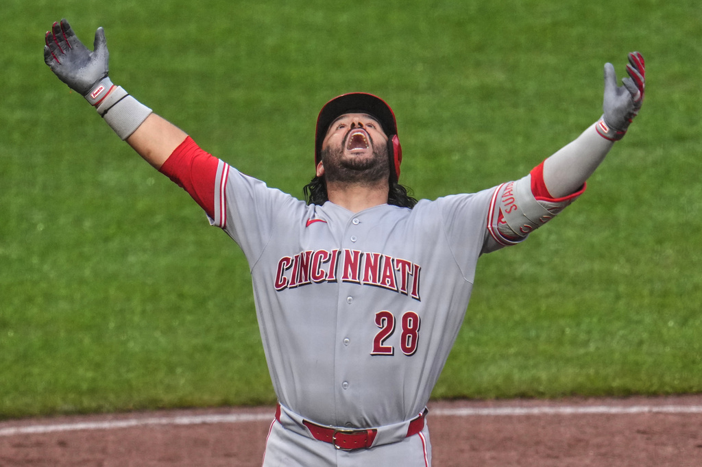 Cincinnati Reds' Eugenio Suárez celebrates as he crosses home plate after hitting a three-run home run off Pittsburgh Pirates pitcher Gregory Soto during the ninth inning of a baseball game in Pittsburgh, Saturday, June 27, 2026. (AP Photo/Gene J. Puskar)