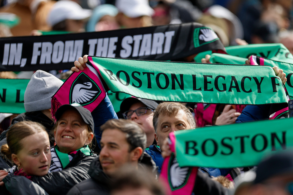 FILE - Fans of Boston Legacy FC hold scarves before the start of an NWSL soccer match against NJ/NY Gotham FC, on March 14, 2026, in Foxborough, Mass. (AP Photo/Greg M. Cooper, File)