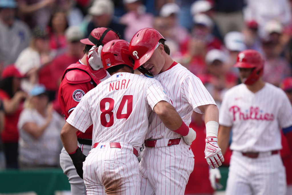 Philadelphia Phillies' Kehden Hettiger, right, and Dante Nori celebrate after Hettiger's two-run home run during the third inning of a spring training baseball game against the Washington Nationals, Thursday, Feb. 26, 2026, in Clearwater. (AP Photo/Matt Slocum)