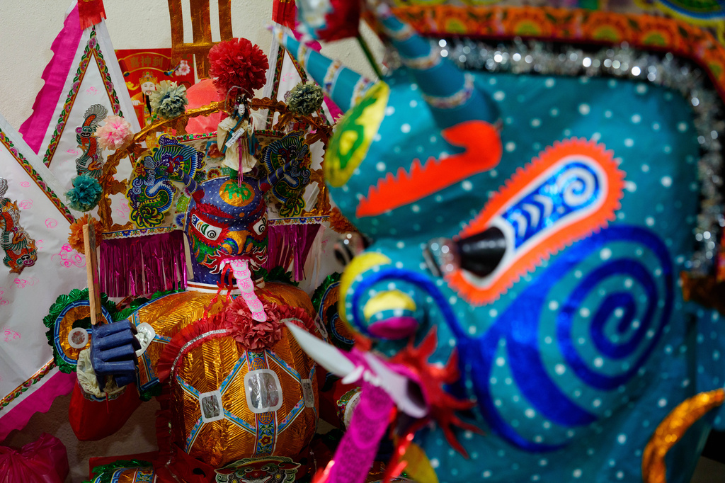 Parts of paper statue of Da Shi Ye, the Guardian God of Ghosts, are seen at workshop during the Hungry Ghost Festival in Bukit Metajam, Malaysia, Friday, Aug. 28, 2026. (AP Photo/Vincent Thian)