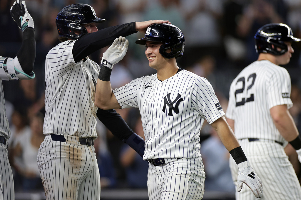 New York Yankees' Anthony Volpe is congratulated after hitting a grand slam during the seventh inning of a baseball game against the Colorado Rockies, Thursday, Sept. 10, 2026, in New York. (AP Photo/Adam Hunger)
