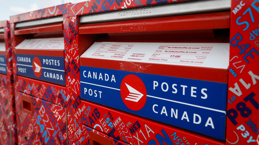 Mail boxes are seen at Canada Post's main plant in Calgary, Alberta, May 9, 2020. (Jeff McIntosh/The Canadian Press via AP)