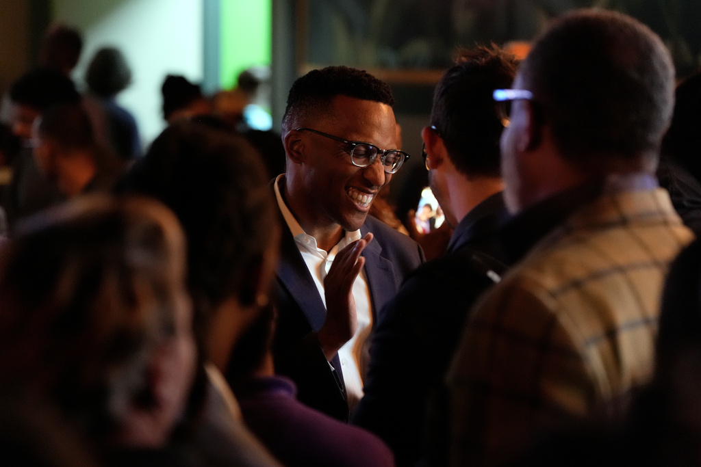 Democratic 18th Congressional District candidate Christian Menefee meets with attendees during an election night watch party on Tuesday, Nov. 4, 2025, in Houston. (AP Photo/Ashley Landis)