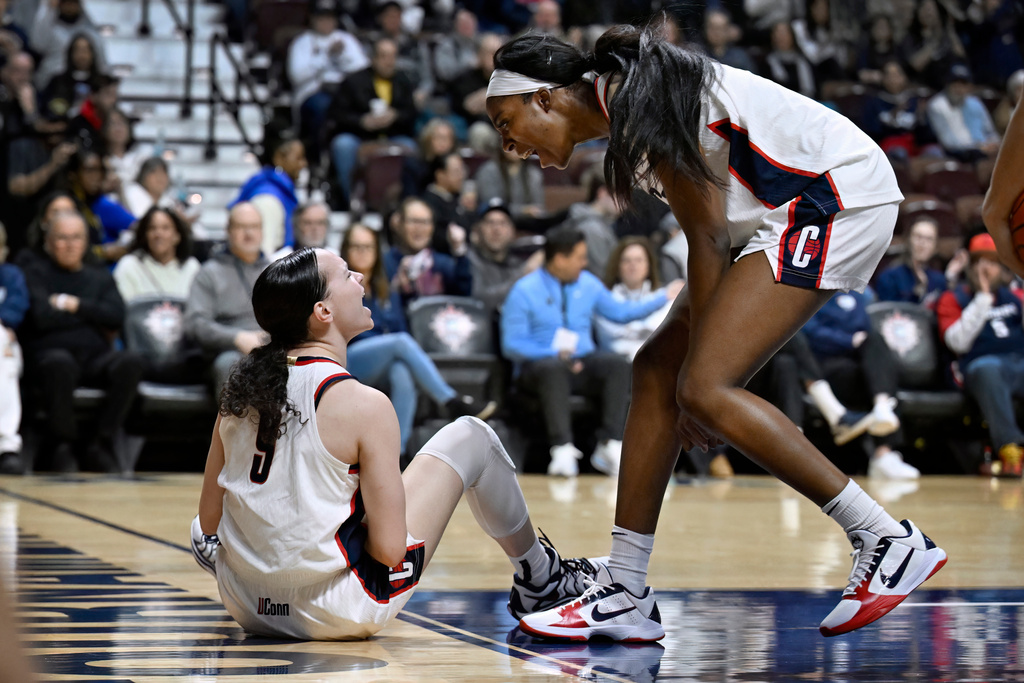 UConn guard Kayleigh Heckel, left, reacts toward UConn forward Serah Williams, right, after Heckel was fouled while making a basket during first half of an NCAA college basketball game against Georgetown in the quarterfinals of the Big East tournament, Saturday, March 7, 2026, in Uncasville, Conn. (AP Photo/Jessica Hill)