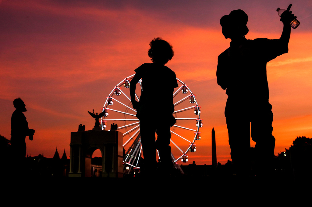 People visit the Great American State Fair, Tuesday, June 30, 2026, on the National Mall in Washington. (AP Photo/Julia Demaree Nikhinson)