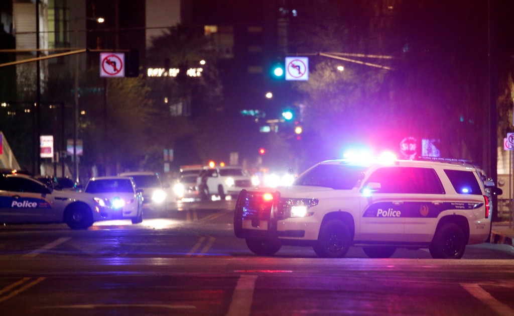 FILE - Phoenix Police Department vehicles block off a street in Phoenix, May 30, 2020. (AP Photo/Ross D. Franklin, File