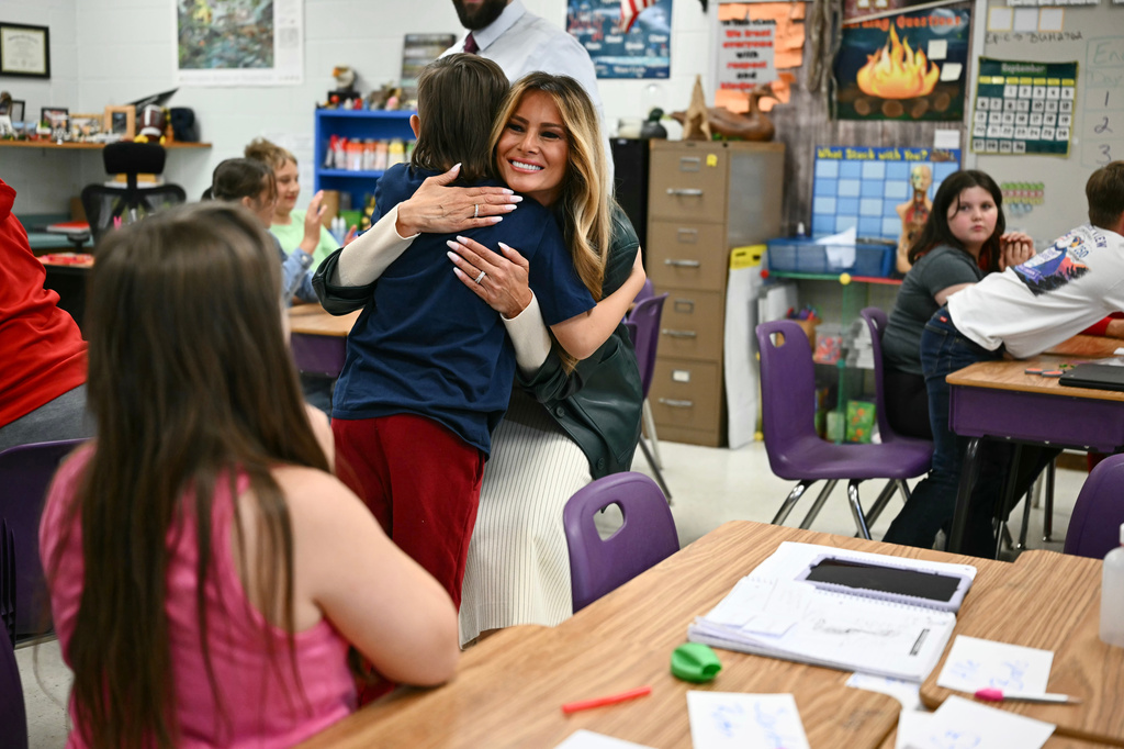 First Lady Melania Trump embraces a student at Mountain View Elementary School in Jefferson, N.C., Tuesday, Sept. 15, 2026. (Kent Nishimura/Pool Photo via AP)