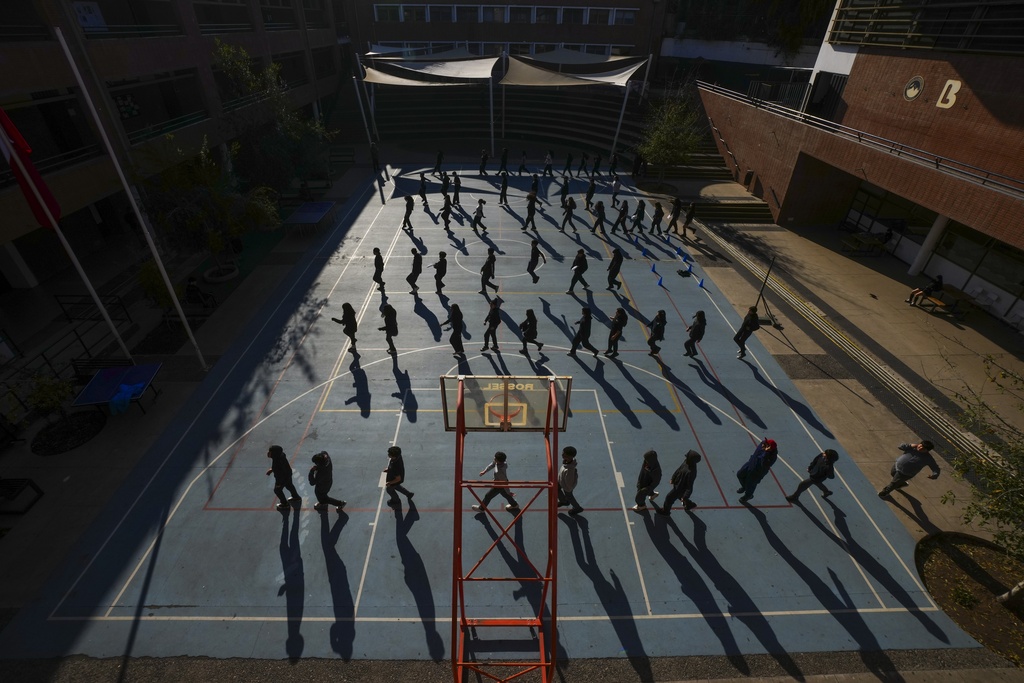 Students rehearse for an event to celebrate Chile's Independence at the Bicentenario School in Santiago, Chile, Monday, Sept. 8, 2025. (AP Photo/Esteban Felix)