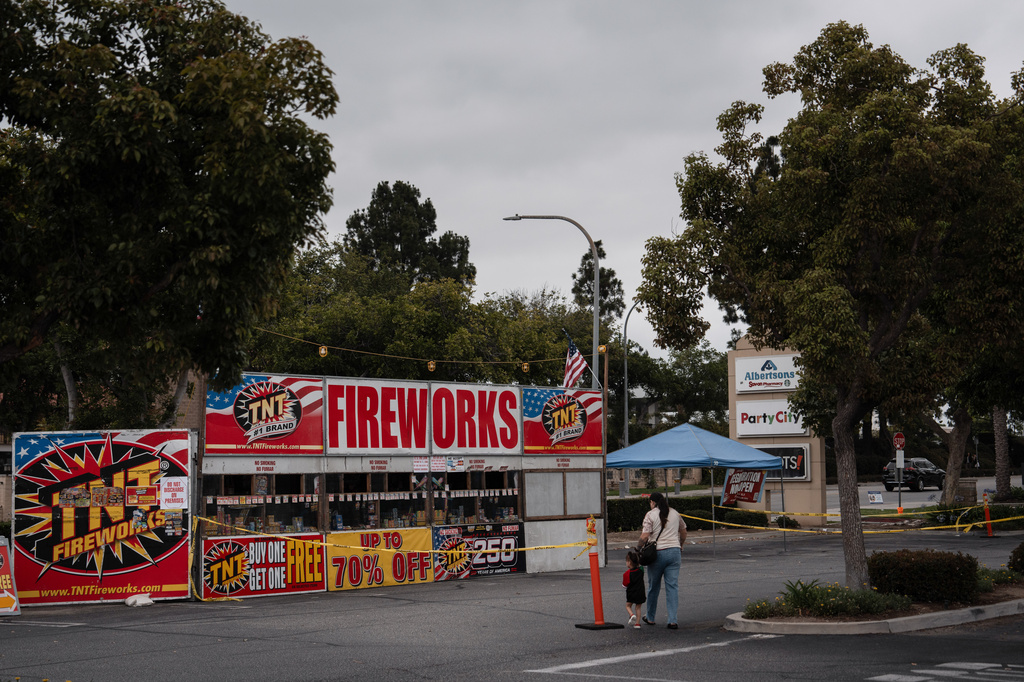 Samantha Ramirez and her daughter Asa walk to a TNT Fireworks stand in Alhambra, Calif., Tuesday, June 30, 2026, to purchase fireworks ahead of the Fourth of July holiday. (AP Photo/Jae C. Hong)