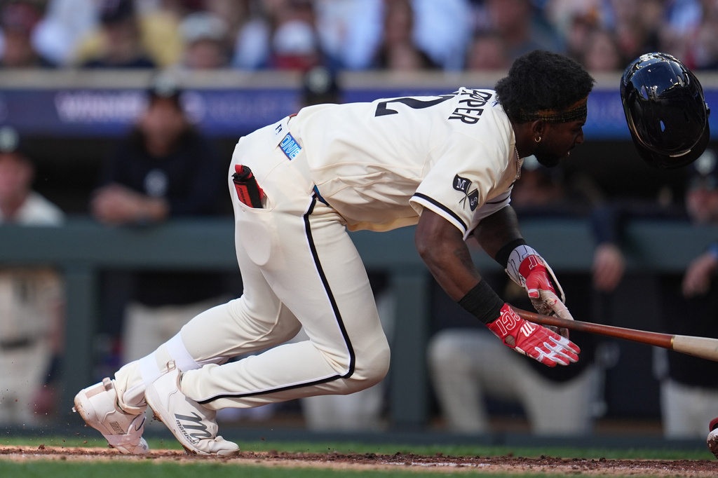 Minnesota Twins' Kaelen Culpepper falls after being hit by a pitch during the third inning of a baseball game against the Cleveland Guardians in Minneapolis, Saturday, Sept. 12, 2026. (AP Photo/Abbie Parr)
