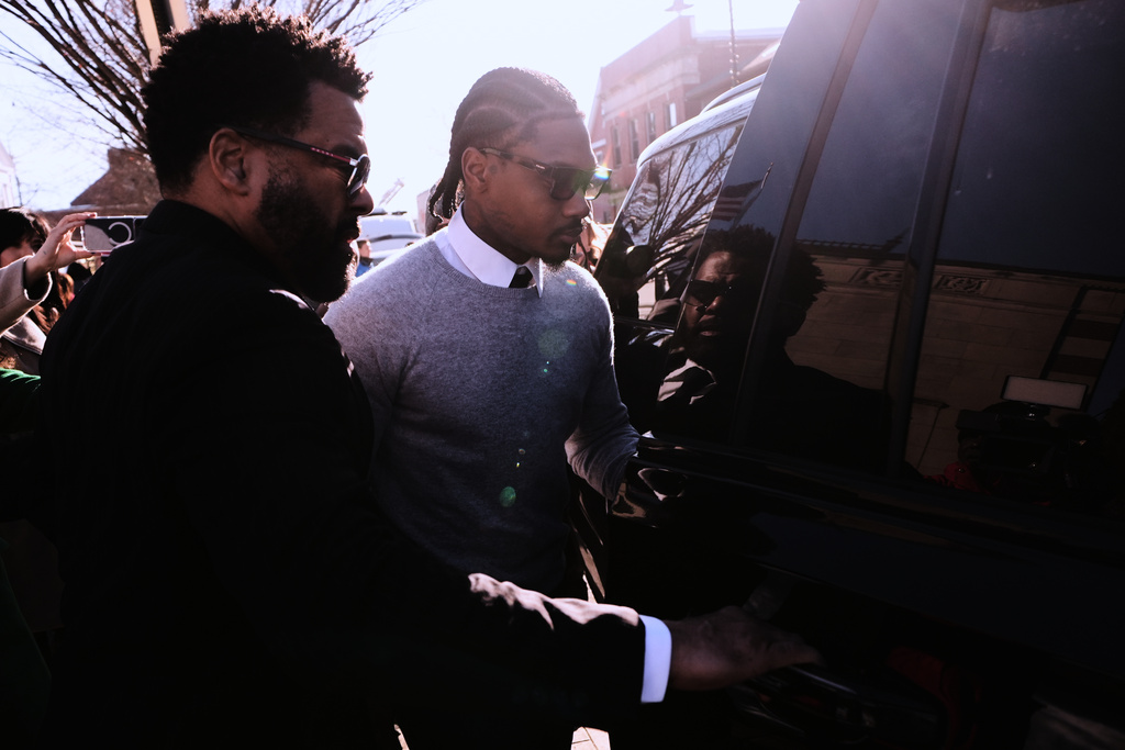 New England Patriots wide receiver Stefon Diggs leaves Norfolk County District Court after his arraignment on felony strangulation and a misdemeanor assault charges, Friday, Feb. 13, 2026, in Dedham, Mass. (AP Photo/Charles Krupa)