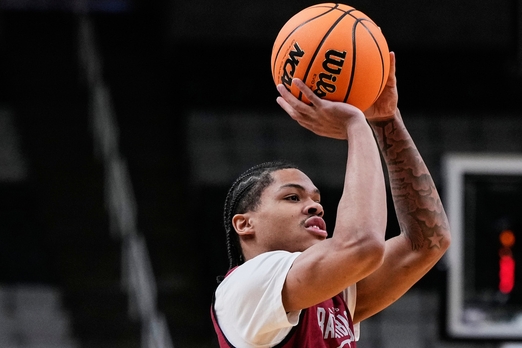 FILE - Arkansas guard Darius Acuff Jr. (5) shoots during practice, March 25, 2026, in San Jose, Calif., ahead of a Sweet 16 game against Arizona in the NCAA college basketball tournament. (AP Photo/Godofredo A. Vásquez, File)