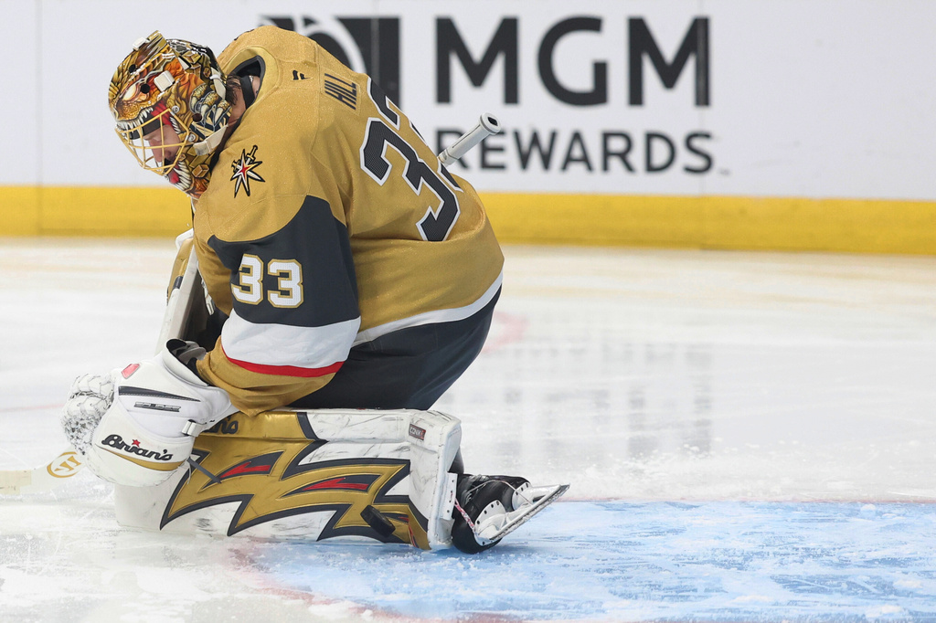 Vegas Golden Knights goaltender Adin Hill makes a save against the Washington Capitals during the first period of an NHL hockey game Saturday, March 28, 2026, in Las Vegas. (AP Photo/Ian Maule)