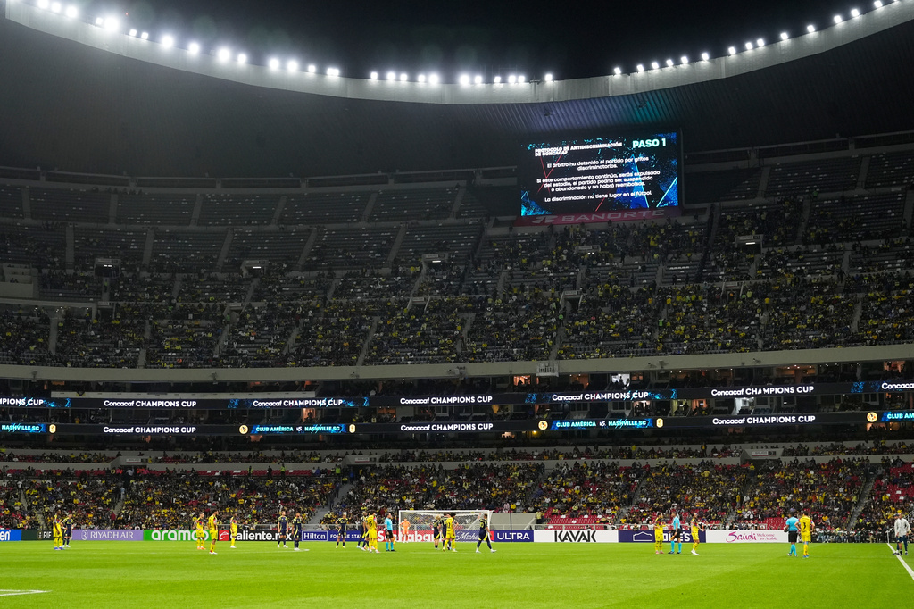 Referee Walter Lopez suspends the match due to discriminatory chants from the crowd during a CONCACAF Champions Cup quarterfinal second leg soccer match between Mexico's America and the United States' Nashville SC in Mexico City, Tuesday, April 14, 2026. (AP Photo/Fernando Llano)