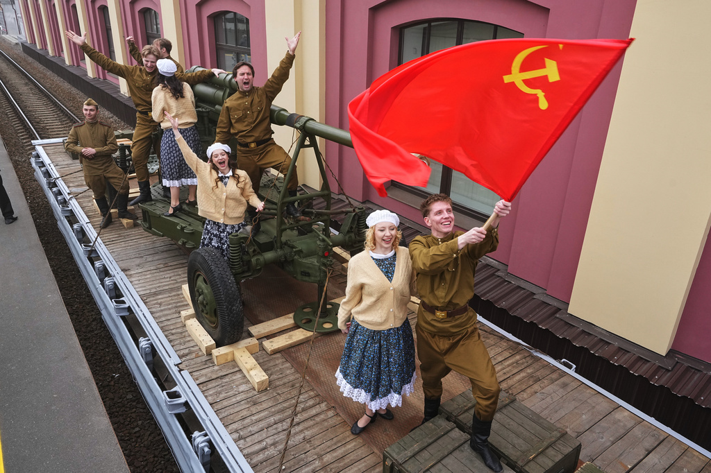 Actors attend a historical reenactment depicting the arrival of trains after the end of the war as a part of celebrations ahead of the 81st anniversary of the Soviet Union's victory over Nazi Germany during World War II, at the Baltiysky railway station in St. Petersburg, Russia, Thursday, May 7, 2026. (AP Photo/Dmitri Lovetsky)