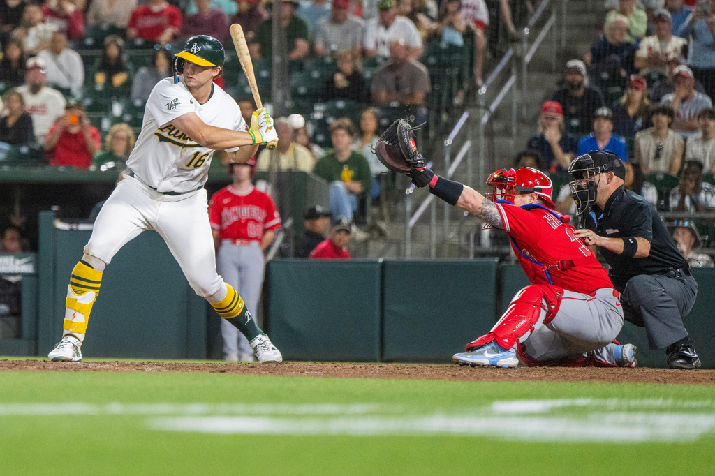 Athletics' Nick Kurtz (16) takes ball four to force a run during the tenth inning of a baseball game beating the Los Angeles Angels in West Sacramento, Calif., Friday, June 19, 2026. (AP Photo/Nic Coury)