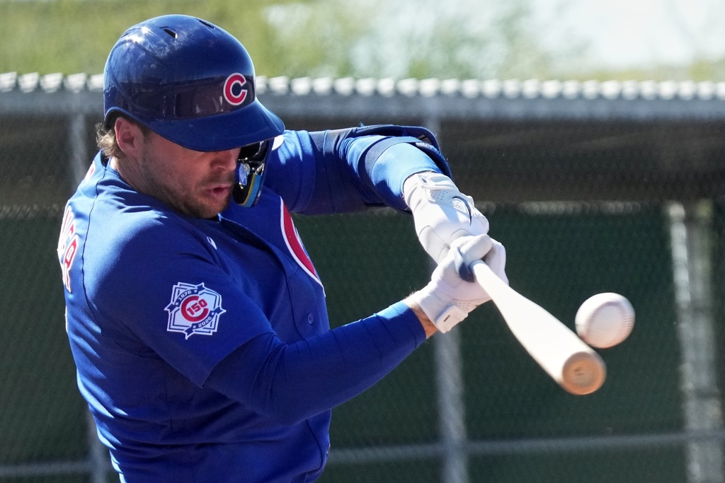 Chicago Cub's Nico Hoerner hits during a spring training baseball workout Saturday, Feb. 14, 2026, in Mesa, Ariz. (AP Photo/Morry Gash)