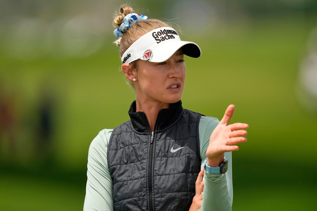 Nelly Korda talks to her caddie on the first hole during the final round of the Women's PGA Championship golf tournament at Hazeltine National Golf Club, Sunday, June 28, 2026, in Chaska, Minn. (AP Photo/Matt York)