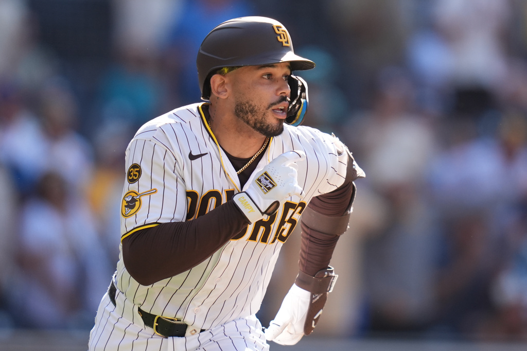 San Diego Padres' Luis Campusano, runs after hitting a walk off single to defeat the Brewers during the eleventh inning of a baseball game Wednesday, Aug. 12, 2026, in San Diego. (AP Photo/Gregory Bull)