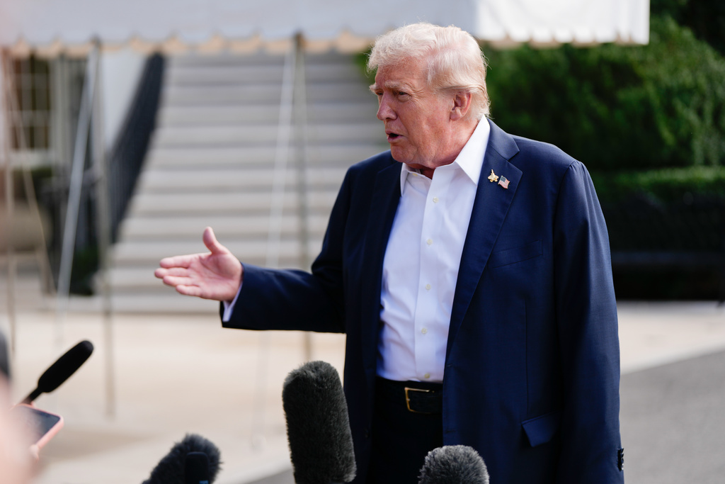 President Donald Trump speaks to reporters before departing the White House, Friday, Sept. 26, 2025, in Washington. (AP Photo/Julia Demaree Nikhinson)