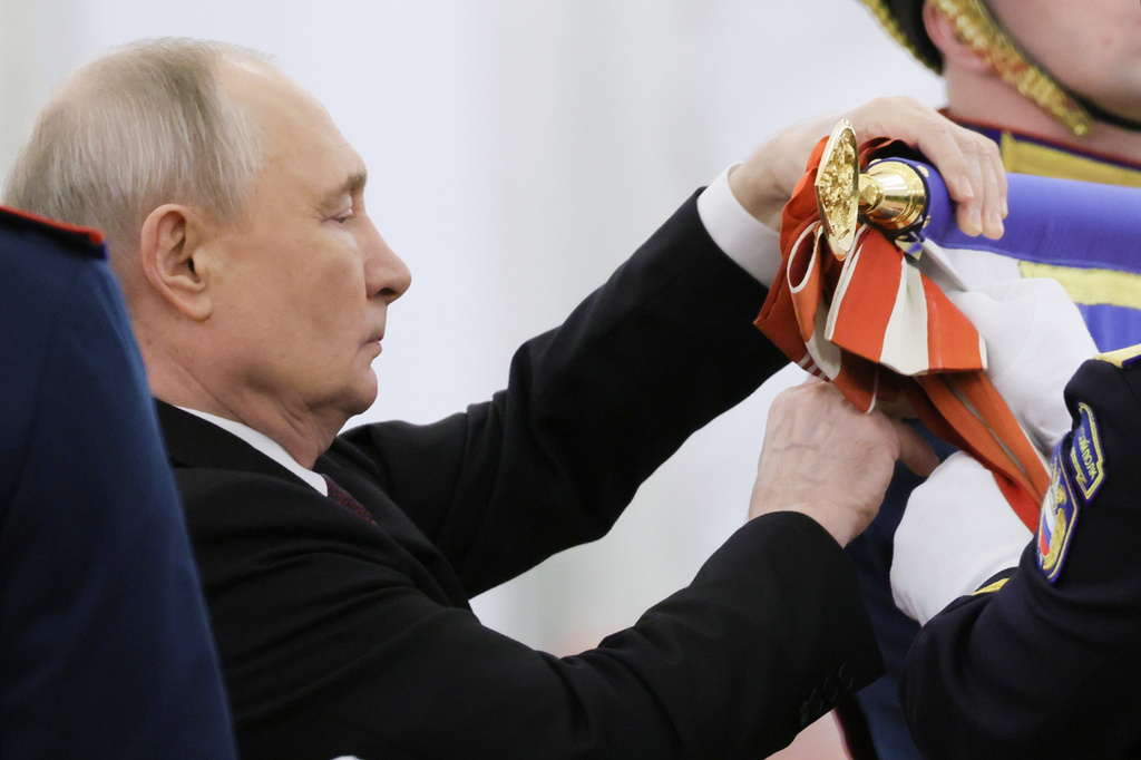 Russian President Vladimir Putin attends a ceremony to present the Order of Zhukov to the Presidential Regiment of the Russian Federal Guard Service at the Kremlin's St. George Hall in Moscow, Tuesday, June 23, 2026. (Mikhail Metzel/Sputnik, Kremlin Pool Photo via AP)