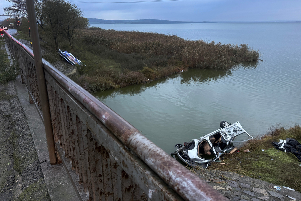 A vehicle is seen crashed out of a road after a police chase near Burgas, Bulgaria, Friday 7 Nov. 2025. (NOVA TV Bulgaria via AP)