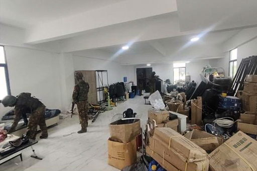 In this image provided by the Myanmar military on Oct. 19, 2025, soldiers raid the KK Park online scam center in Myawaddy township, Karen State, Myanmar. (The Myanmar Military True News Information Team via AP) In this image provided by the Myanmar military on Oct. 19, 2025, soldiers raid the KK Park online scam center in Myawaddy township, Karen State, Myanmar. (The Myanmar Military True News Information Team via AP)