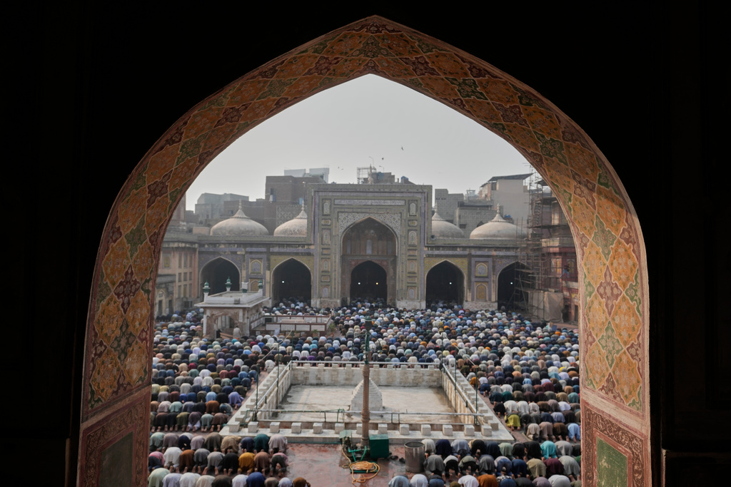 Muslims attend Friday prayers during the Muslim holy fasting month of Ramadan, at the historic Wazir Khan mosque, in Lahore, Pakistan, Friday, Feb. 20, 2026. (AP Photo/K.M. Chaudary)