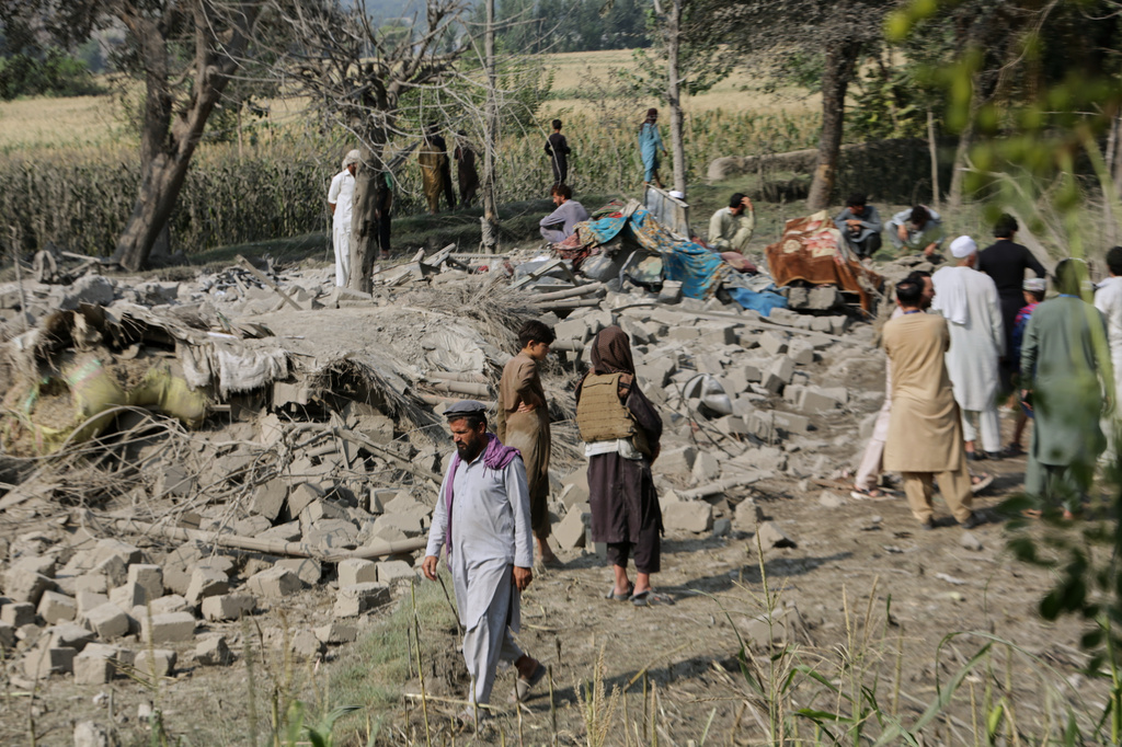 Residents inspect the rubble of a house destroyed in a strike in Patan village, Kunar province, eastern Afghanistan, Monday, Sept. 21, 2026. (AP Photo/Shafiullah Kakar)