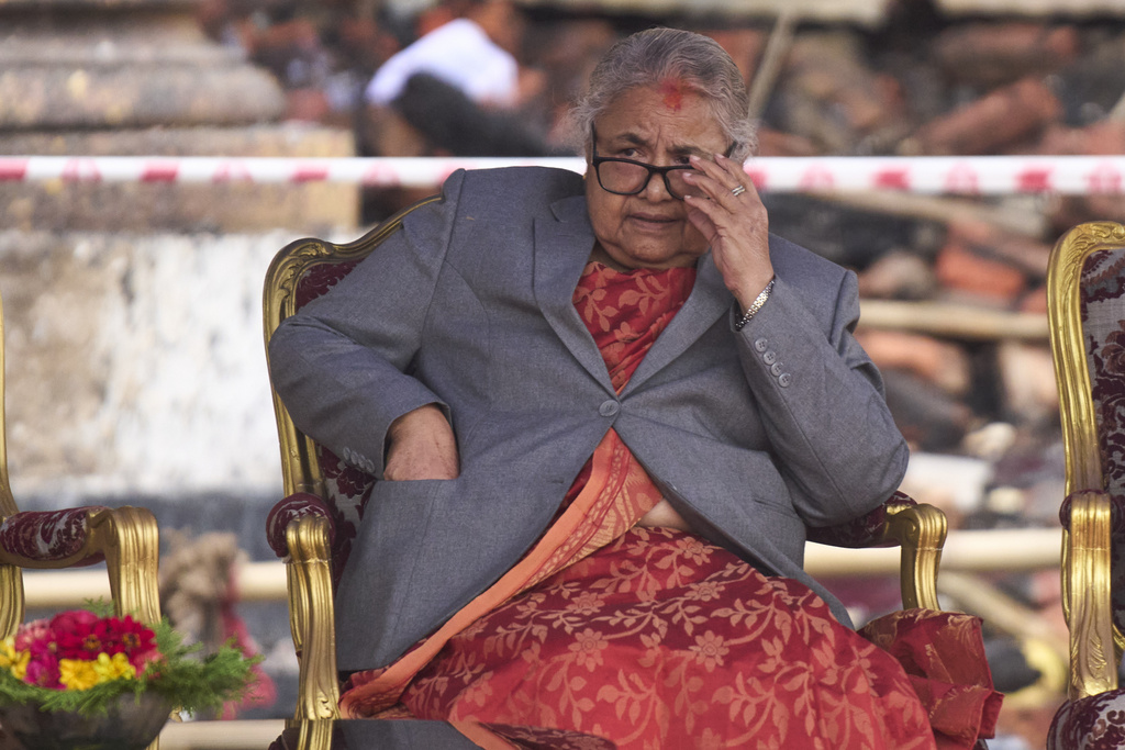 Nepal's new prime minister Sushila Karki waits for ministers to be administered the oath of office by Nepalese President Ram Chandra Poudel at the presidential building in Kathmandu, Nepal, Monday, Sept. 15, 2025. (AP Photo/Niranjan Shrestha)
