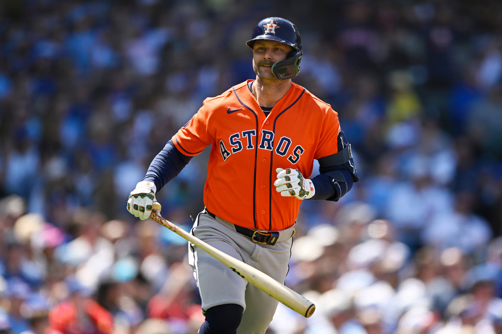 Houston Astros' Christian Walker looks to the dugout after hitting a three-run home run during the fifth inning of a baseball game against the Chicago Cubs in Chicago, Sunday, May 24, 2026. (AP Photo/Paul Beaty)