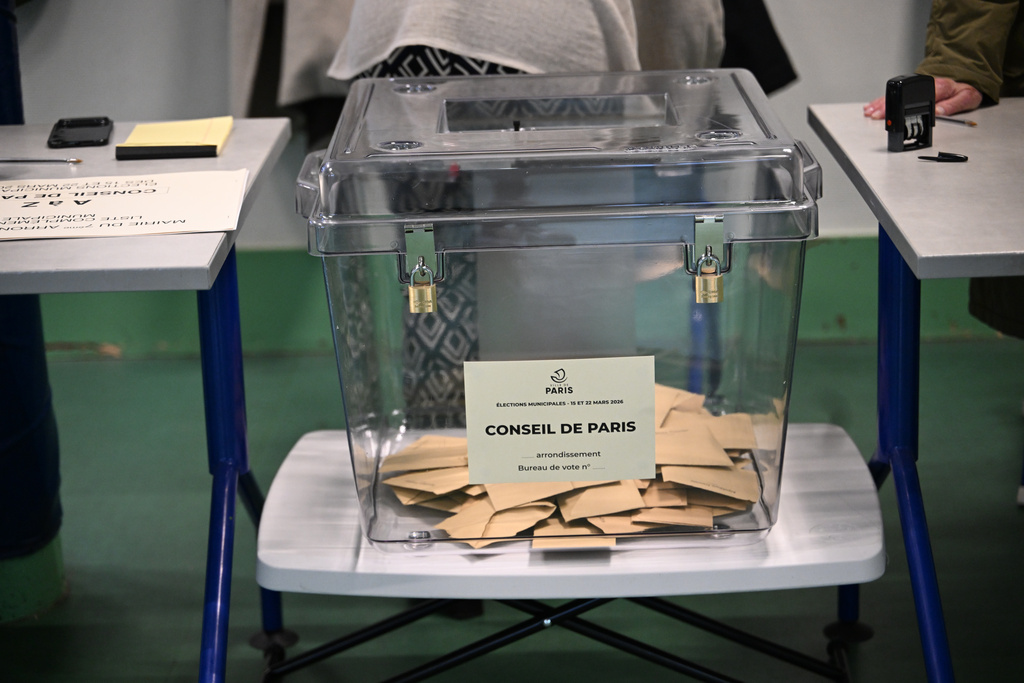 Ballots inside a box at a polling station during the first round of the municipal elections in Paris, France, Sunday March 15, 2026. (AP Photo/Emma Da Silva)