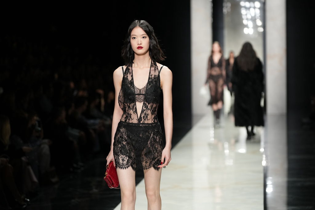 A model wears a creation from the Dolce & Gabbana Fall/Winter 2026-2027 Women's collection, presented in Milan, Italy, Saturday, Feb. 28, 2026. (AP Photo/Antonio Calanni)