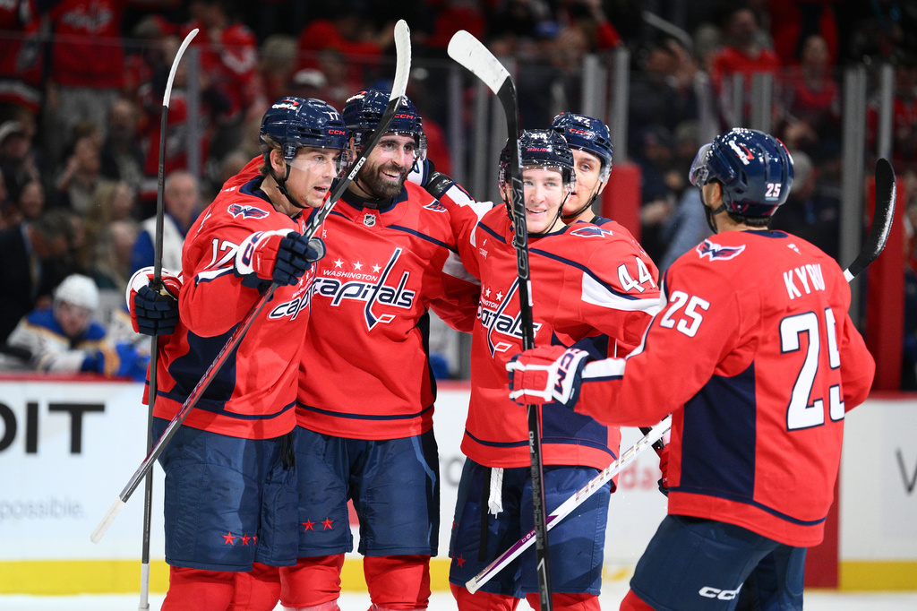 Washington Capitals right wing Alex Tuch, second from left, celebrates his goal with teammates during the first period of an NHL hockey game against the Buffalo Sabres, Saturday, Oct. 24, 2026, in Washington. (AP Photo/Nick Wass)