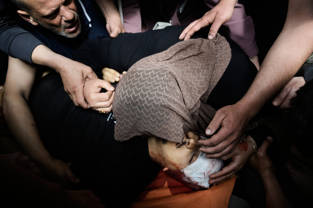 Mother of Nayef Samaro, 26, who was killed in clashes with Israeli forces, mourns over his body at Rafidia Hospital in the West Bank city of Nablus, Sunday, May 3, 2026. (AP Photo/Majdi Mohammed)