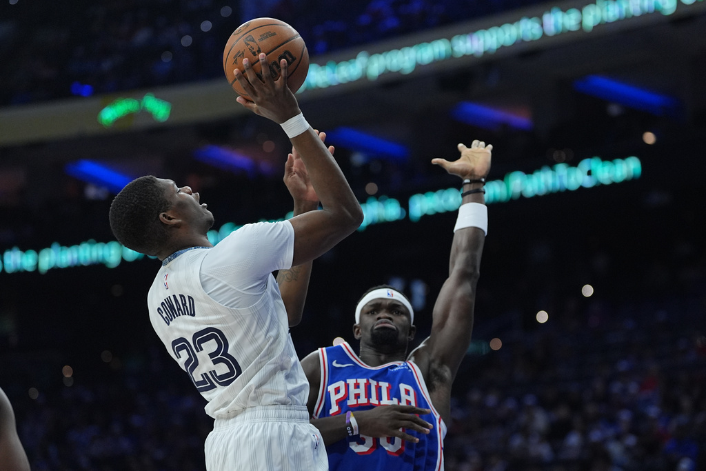 Memphis Grizzlies' Cedric Coward (23) goes up to shoot against Philadelphia 76ers' Adem Bona during the first half of an NBA basketball game, Tuesday, March 10, 2026, in Philadelphia. (AP Photo/Matt Rourke)
