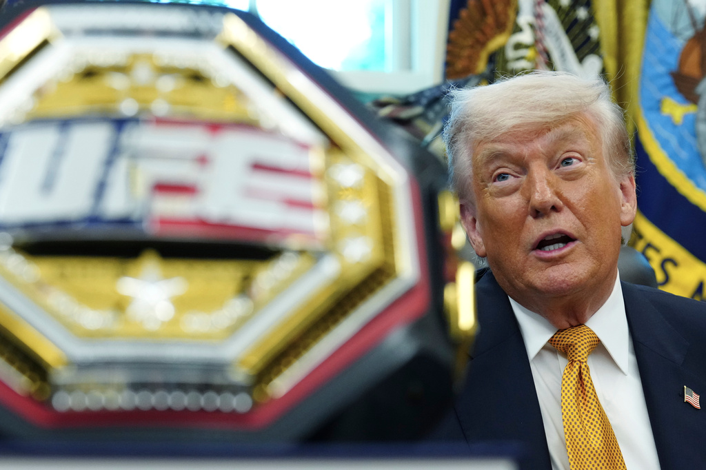 President Donald Trump meets with UFC fighters, Wednesday, May 6, 2026, in the Oval Office of the White House, in Washington. (AP Photo/Jacquelyn Martin)