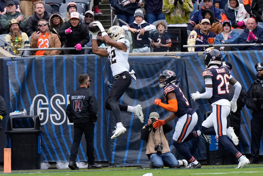New Orleans Saints wide receiver Chris Olave (12) pulls in a touchdown reception in the second half of an NFL football game against the Chicago Bears, Sunday, Oct. 19, 2025, in Chicago. (AP Photo/Nam Huh)