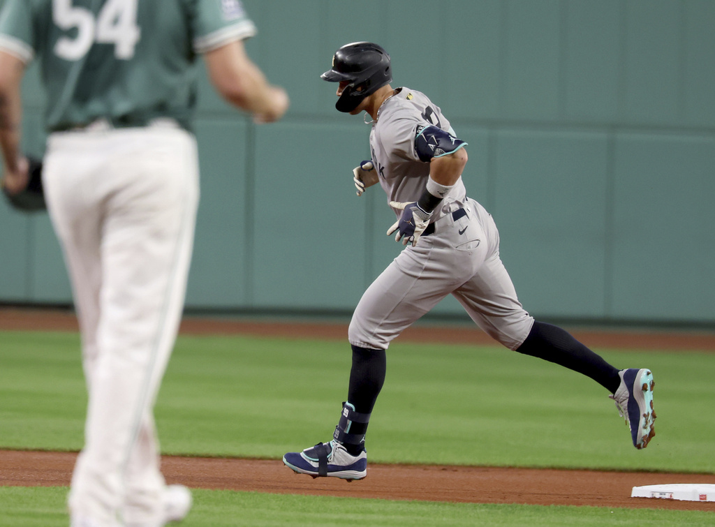 New York Yankees designated hitter Aaron Judge rounds second base after hitting a home run during the first inning of a baseball game against the Boston Red Sox, Friday, Sept. 12, 2025, in Boston. (AP Photo/Mark Stockwell)