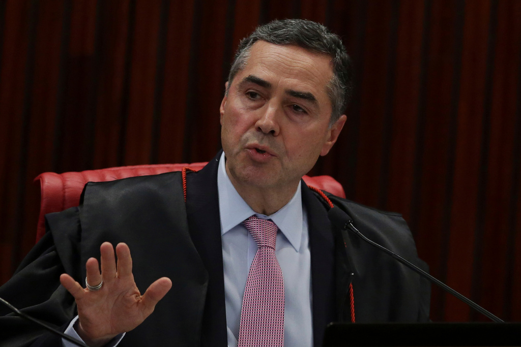 FILE - Brazil's Minister of the Superior Electoral Court Luis Roberto Barroso speaks during the trial against the candidacy of jailed former President da Luiz Inacio Lula da Silva, in Brasilia, Brazil, Aug. 31, 2018. (AP Photo/Eraldo Peres, File)